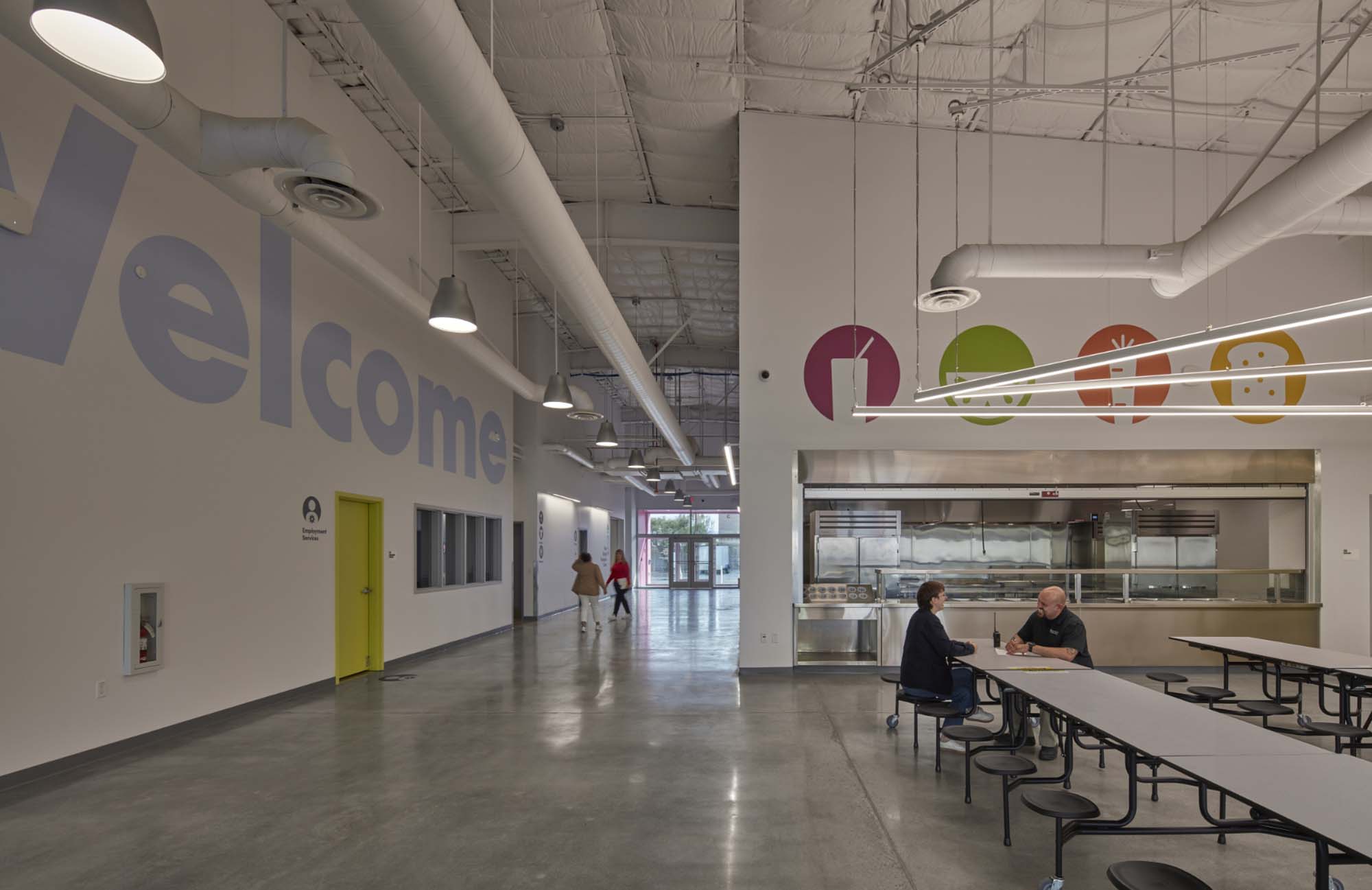 welcome and dining area with colorful wall graphics