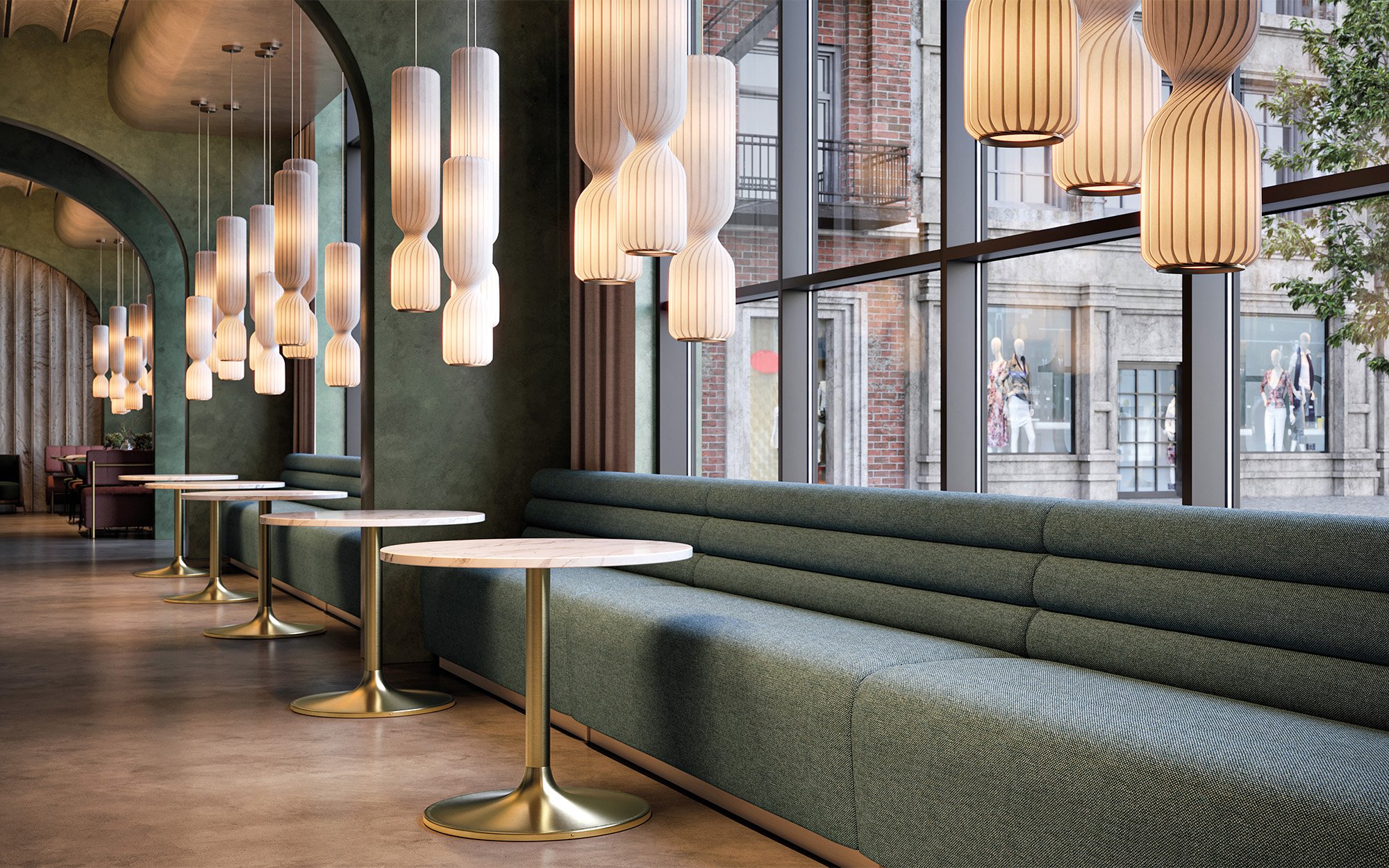 Emblem furniture in hospitality space with hanging light fixtures