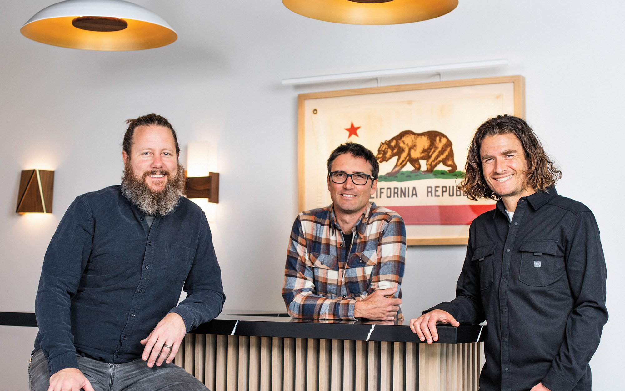 Cerno owners at counter with california state flag in backgound