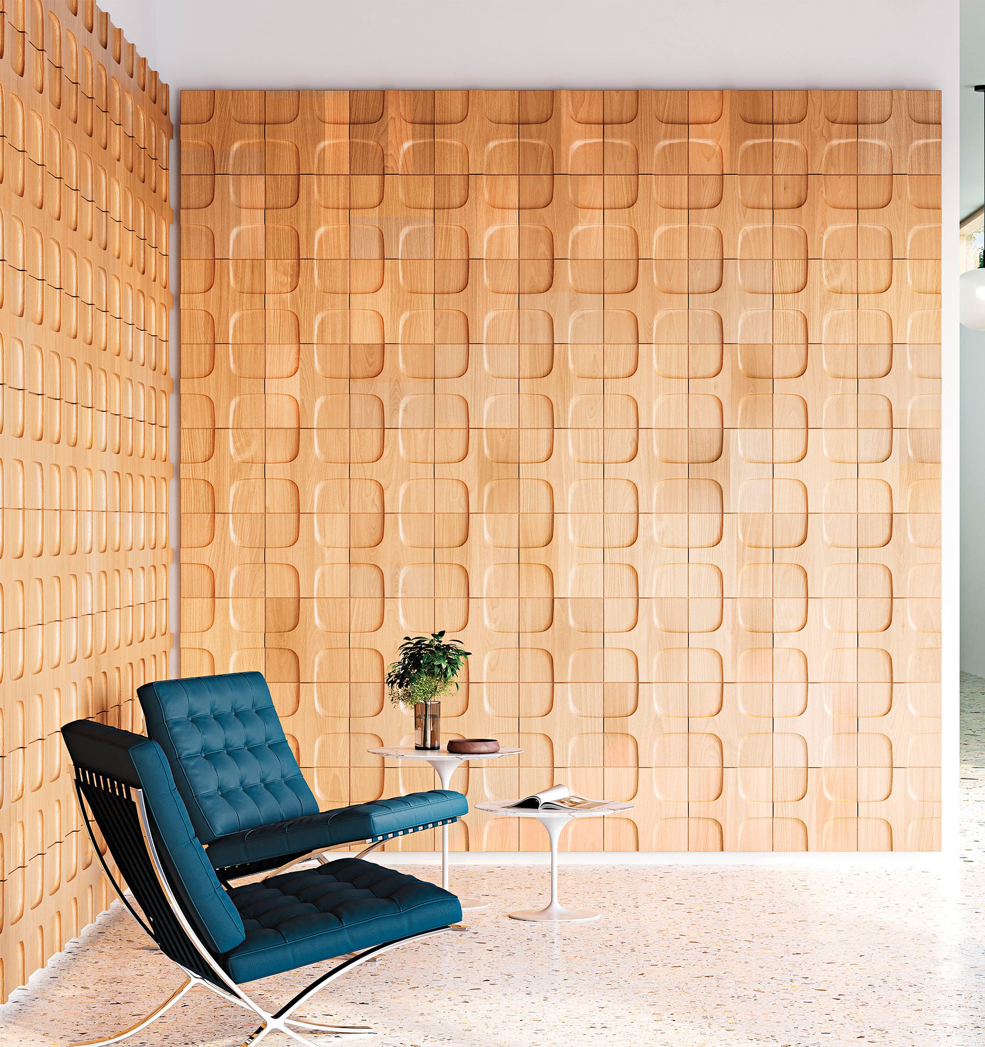 A wall made in all wood panel pieces and 2 lounge navy blue chairs kept in front of it.